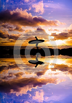 Sunset surfer silhouette reflection