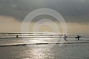 Sunset surfing at kuta beach.