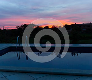 Sunset and swimming pool