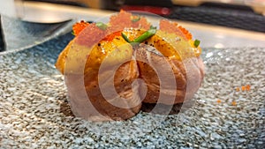 Sunset Symphony: Tempting Salmon Sushi with Creamy Mentai Drizzle