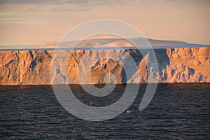 Sunset with tabular iceberg photo