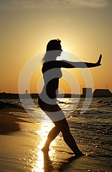 Sunset Tai Chi on a beach