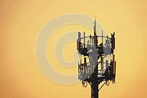 Sunset and Tall mast with cellular antenna