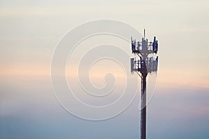Sunset and Tall mast with cellular antenna photo