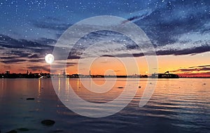 Sunset Tallinn  Old town Panorama starry night and moon on sky,summer night seascape city light reflexion on water in harbor ,B