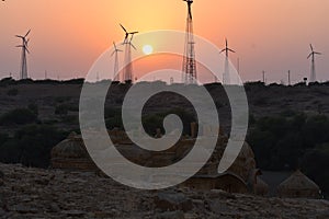 Sunset with modern windmills in badabaag jaisalmer Rajasthan India