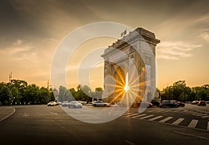 Sunset throuigh theArch of Triumph Bucharest Romania Arcul de triumf photo