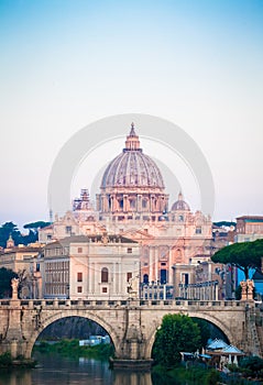 Sunset on Tiber river bridge with Vatican City - Rome, Italy