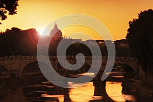 Sunset on Tiber river, Tevere, in Rome with St Peter dome