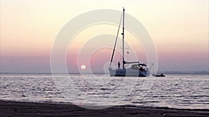 Sunset time-lapse & boat silhouette at Ria Formosa. Algarve. Portugal