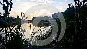 Sunset with time lapse in the city lake