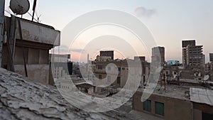 Sunset time lapse view from decay rooftops on Cairo City, Egypt
