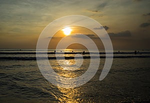 Sunset time and people activities in the beach, Kuta-Bali, Indonesia