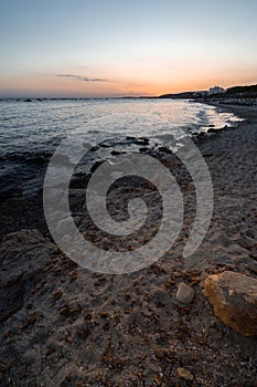 Sunset time in Santo Tomas beach on the island of Menorca.