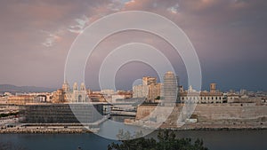 Sunset timelapse over the Major Cathedral and Fort Saint-Jean at the entrance of ole port in Marseille, France