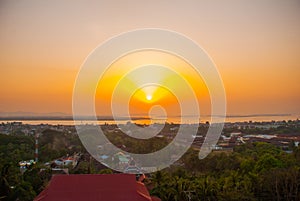 Sunset. Top view of the city Mawlamyine from the pagoda Kyaik Tan Lan. Myanmar. Burma.