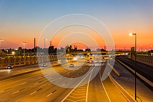 Sunset traffice over Highway 40 and cityscape