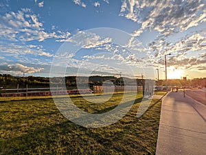 Sunset with a train station in the background