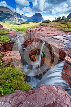 Sunset at Triple Falls in Glacier National Park, Montana, USA photo