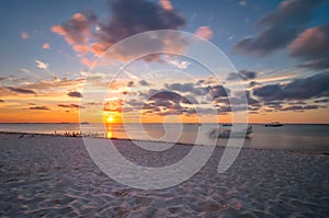 Sunset on tropical beach in Isla Mujeres, Mexico photo