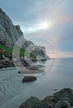 Sunset twilight colors at Morro Rock on the central coast of California at Morro Bay California USA