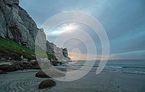 Sunset twilight colors at Morro Rock on the central coast of California at Morro Bay California USA