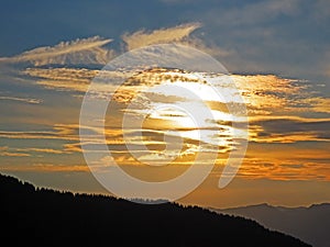 Sunset or twilight with evening clouds in the sky above the Swiss mountains in the Uri Alps massif, Kerns - Canton of Obwald