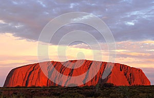 Uluru Ayers Rock (Unesco) is on fire at sunset, Australia