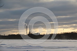 Sunset under field full of snow