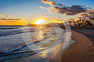 Sunset on vacation in the mediterranean. Golden hour by the sea. Sitges, Spain