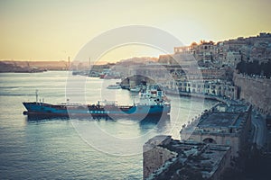 Sunset in Valleta, Malta. Old harbour at sunset with overview of