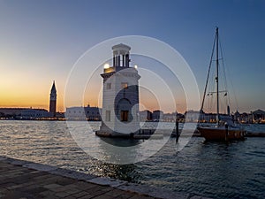 sunset in venice with a lighthouse