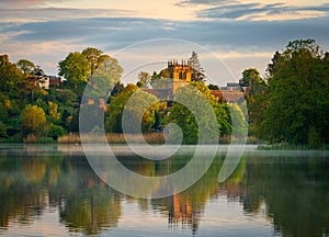 Sunset view across Ellesmere Mere in Shropshire to church