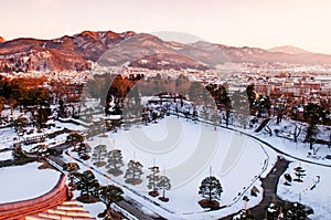 Sunset view of Aizu Wakamatsu city and castle park from aerial a
