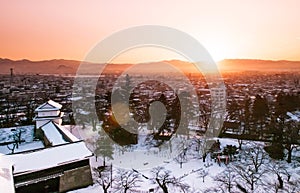 Sunset view of Aizu Wakamatsu city and castle park from aerial a