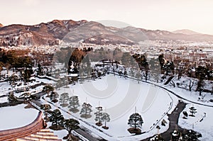 Sunset view of Aizu Wakamatsu city and castle park from aerial a