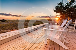 Sunset view of the beach with beach chairs