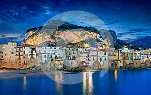 Sunset view of beautiful Cefalu, small resort town on Tyrrhenian coast of Sicily, Italy