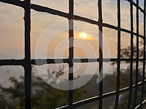 Sunset view through cage