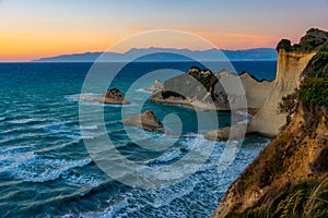 Sunset view of Cape Drastis a Corfu island, Greece