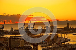 Sunset view of the city of Genoa, Italy/ Genoa landscape/ Genoa Skyline/ city landscape/ aereal view/ light/ city light/ orange/ s