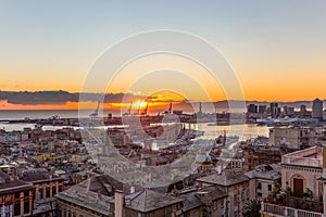 Sunset view of the city of Genoa, Italy/ Genoa landscape/ Genoa Skyline/ city landscape/ aereal view/ light/ city light/ orange/ s