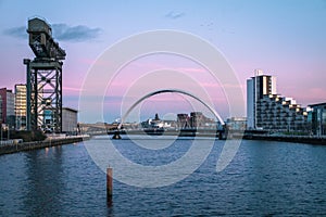 Sunset view of the Clyde Arc or Squinty Bridge and river Clyde