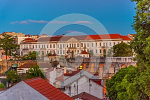 Sunset view of Coimbra dominated by a military building, Portugal photo