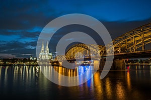 Sunset view of Cologne Cathedral and Hohenzollern Bridge,