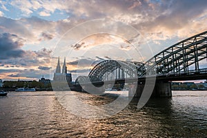 Sunset view of Cologne Cathedral and Hohenzollern Bridge,