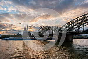 Sunset view of Cologne Cathedral and Hohenzollern Bridge,