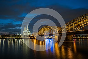 Sunset view of Cologne Cathedral and Hohenzollern Bridge,