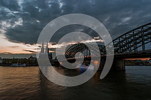 Sunset view of Cologne Cathedral and Hohenzollern Bridge,