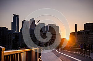 Sunset view of the Downtown Minneapolis Skyline as seen from on the Stone Arch Bridge